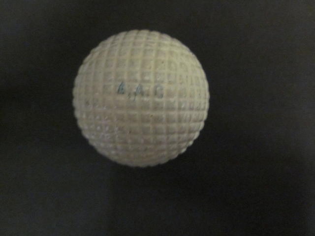 Six 'Silver Town 27½ No.4' moulded mesh gutta-percha white golf ball